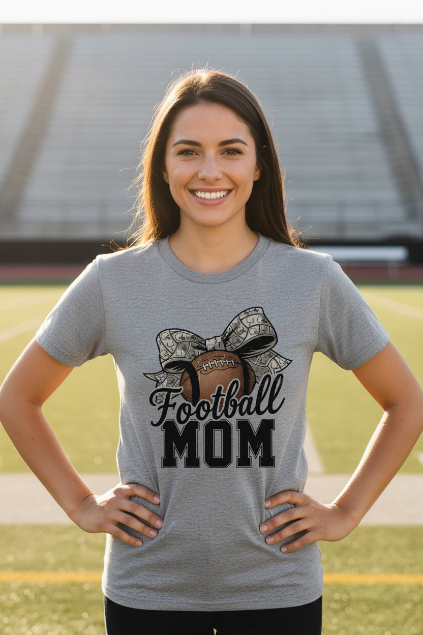 Football Mom Life – Chic Bow Game Day Statement T-Shirt ATHLETIC HEATHER - 6004 - FRONT