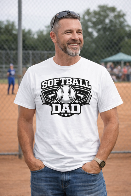 Man wearing a 'SOFTBALL DAD' t-shirt on a baseball field